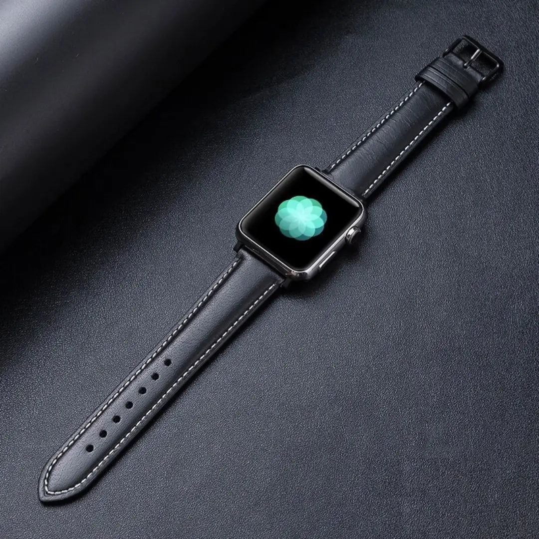 Genuine leather Apple Watch band in oil-waxed finish with classic pattern, displayed on a black background.