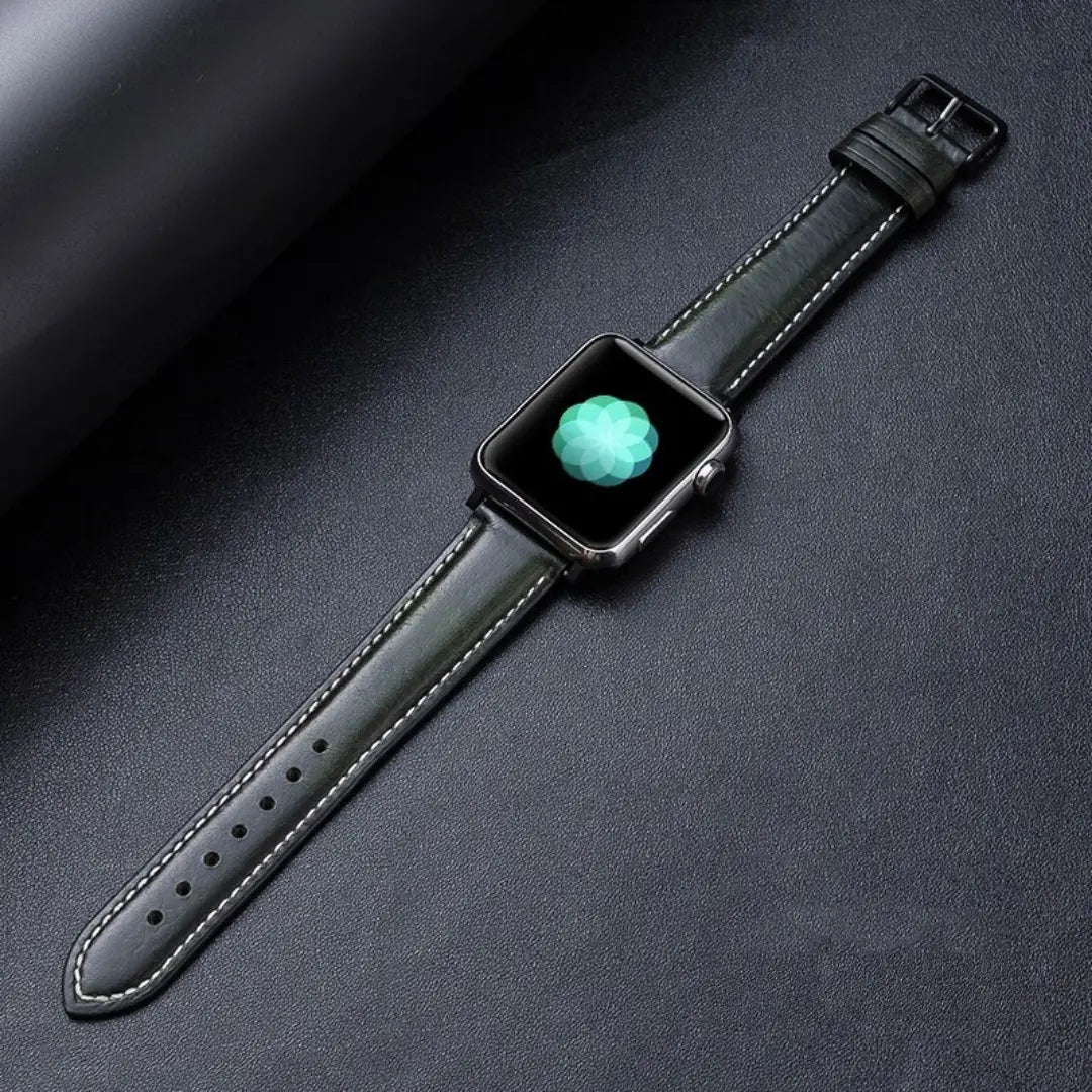 Oil waxed genuine leather Apple Watch band showcased on a dark surface, featuring a classic design and elegant craftsmanship.