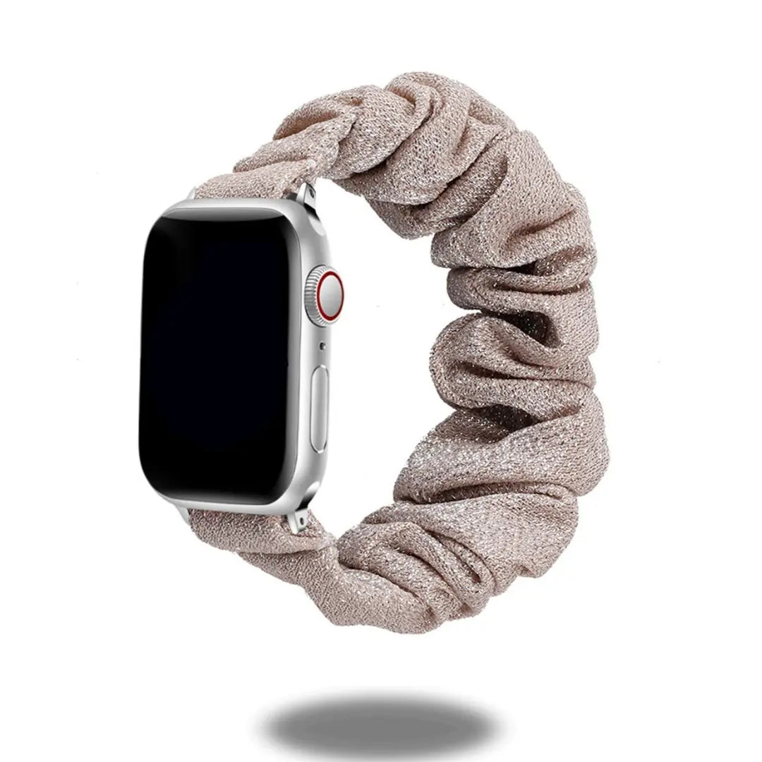 Scrunchie band for Apple Watch in soft beige fabric, stylish and comfortable accessory for daily wear.