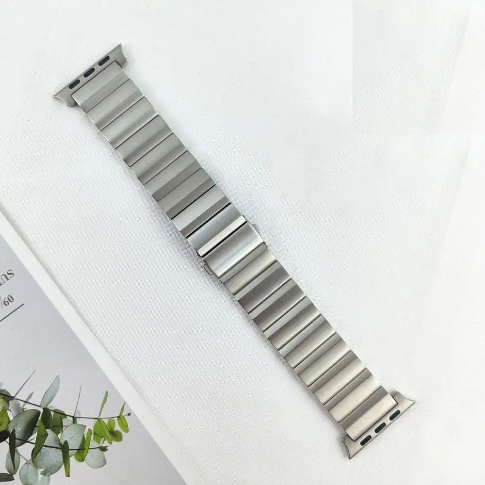 Premium titanium bracelet for Apple Watch, featuring a sleek, durable design and seamless integration.