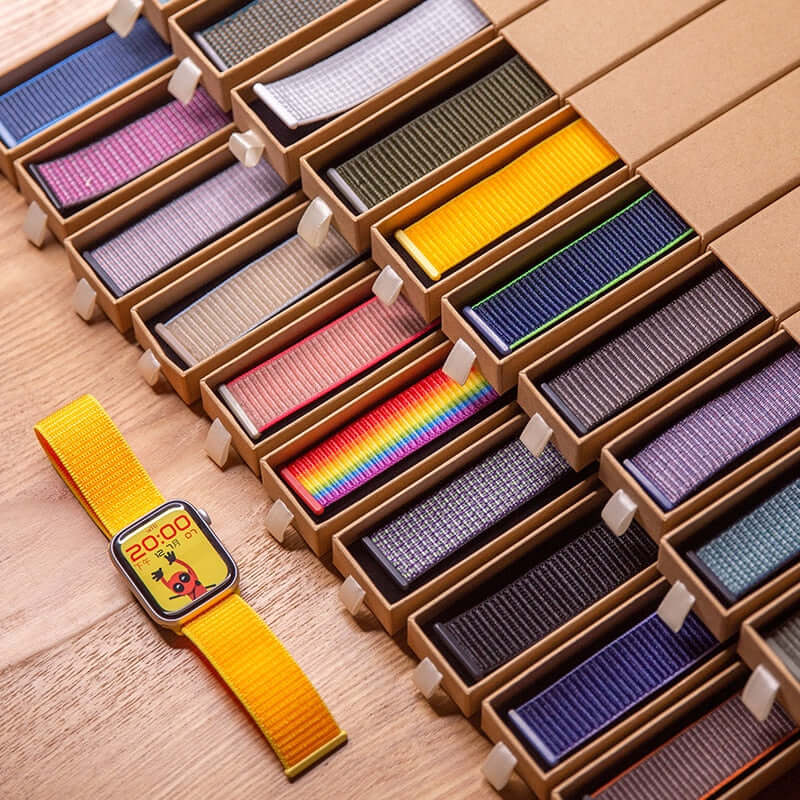Colorful nylon sport loop bands displayed with a yellow banded smartwatch, showcasing comfort and style for active lifestyles.