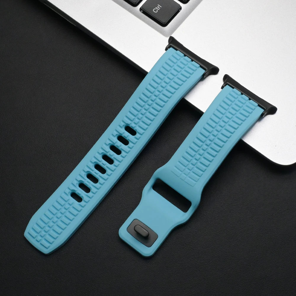 Soft Silicone Sport Band for Samsung Galaxy Watch Ultra & 8 in blue resting on a laptop, ideal for active lifestyles.