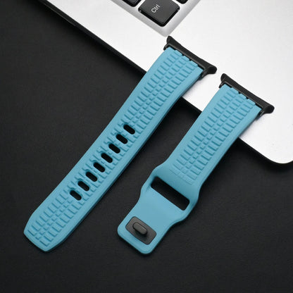 Soft Silicone Sport Band for Samsung Galaxy Watch Ultra & 8 in blue resting on a laptop, ideal for active lifestyles.