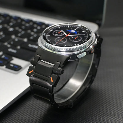 No Gaps Titanium Band for Samsung Galaxy Watch Ultra 47mm on a watch with a black strap next to a laptop.