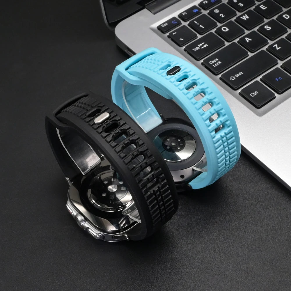 Soft Silicone Sport Band for Samsung Galaxy Watch Ultra & 8 in black and blue displayed next to a laptop.
