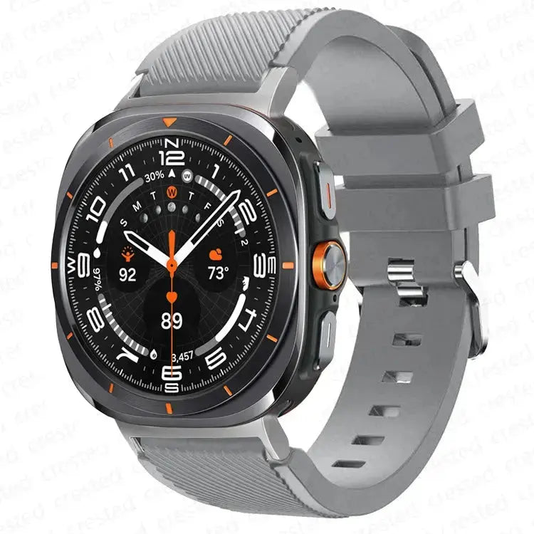 Warrior, the Rugged Band for Samsung Galaxy Watch Ultra in grey silicone with a sturdy metal buckle.