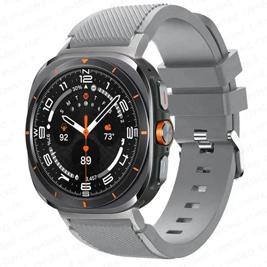 Warrior, the Rugged Band for Samsung Galaxy Watch Ultra in grey silicone with a sturdy metal buckle.