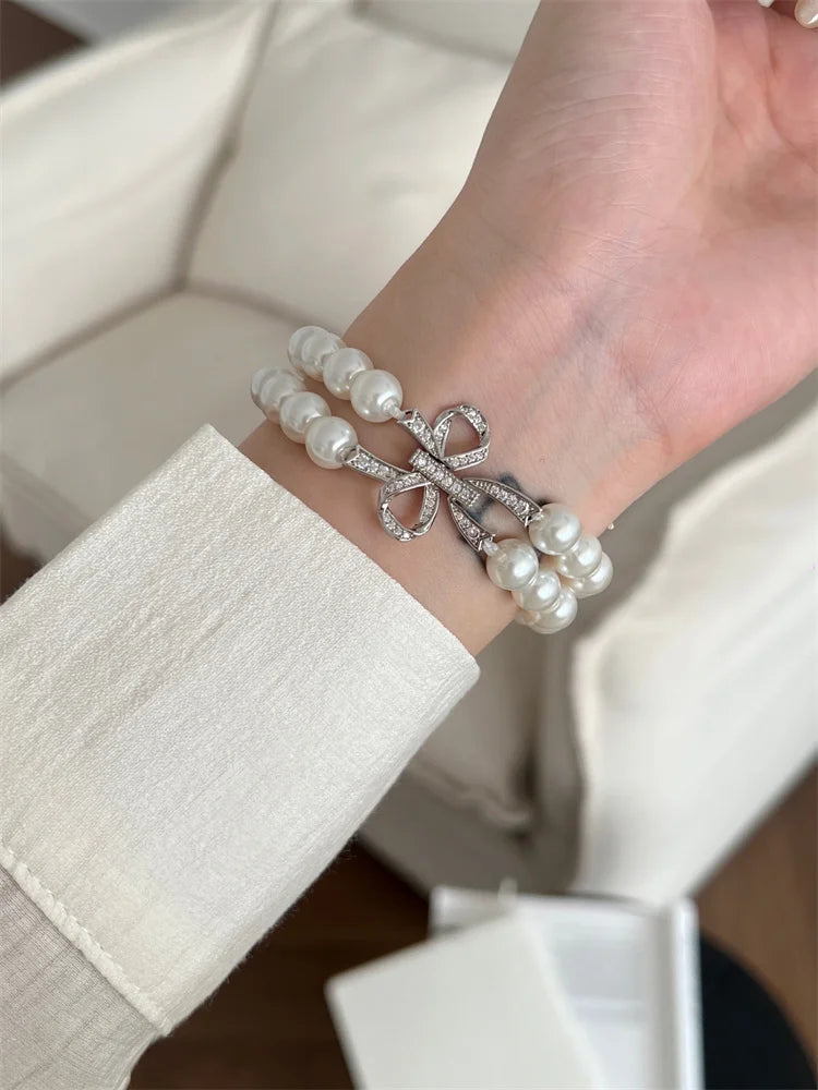 Luxury Pearl & Diamond Bow Apple Watch Band (38–49mm)
