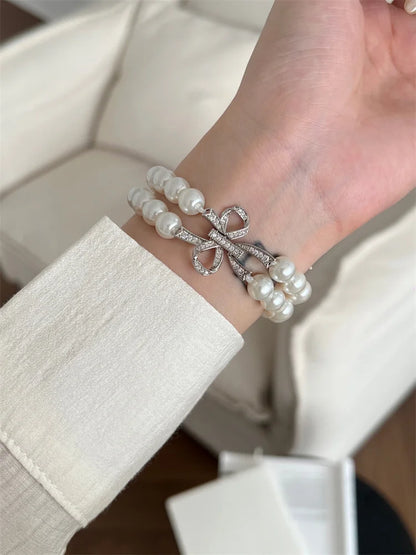 Luxury Pearl & Diamond Bow Apple Watch Band (38–49mm)