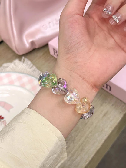 Love Band for Apple Watch – Laser Acrylic Bracelet Strap for Women with iridescent heart-shaped beads on wrist.