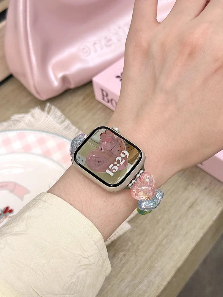 Love Band for Apple Watch – Laser Acrylic Bracelet Strap for Women worn on wrist with colorful design and watch face display.