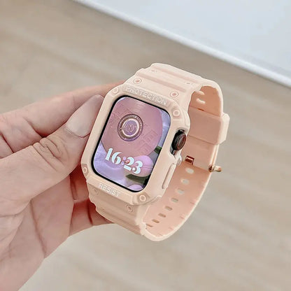 Close-up of a hand holding an Apple Watch with a peach clear case and a matching strap, showcasing its sleek design and display.