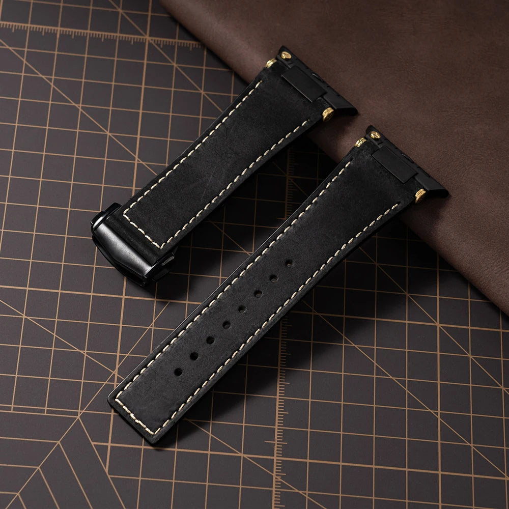Apple Watch Leather Strap – Luxury Business Band (44–49mm) in black leather with gold stitching on a brown background.