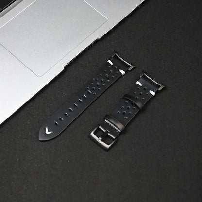 Leather Samsung Galaxy Watch 8 Bands | Classic & Ultra 47mm Strap close-up on a black background with a laptop.
