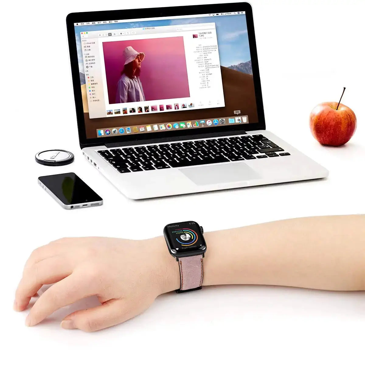 Stylish hand wearing Retro Style Leather Apple Watch Strap next to laptop and smartphone, showcasing luxury design.