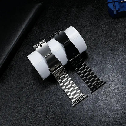 Classic stainless steel watch straps in silver and black on display, perfect for stylish occasions and comfortable wear.