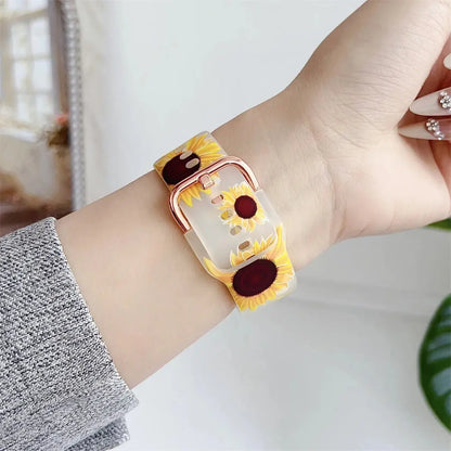 Clear silicone Apple Watch band with sunflower design, featuring a secure metal buckle for a stylish, adjustable fit.