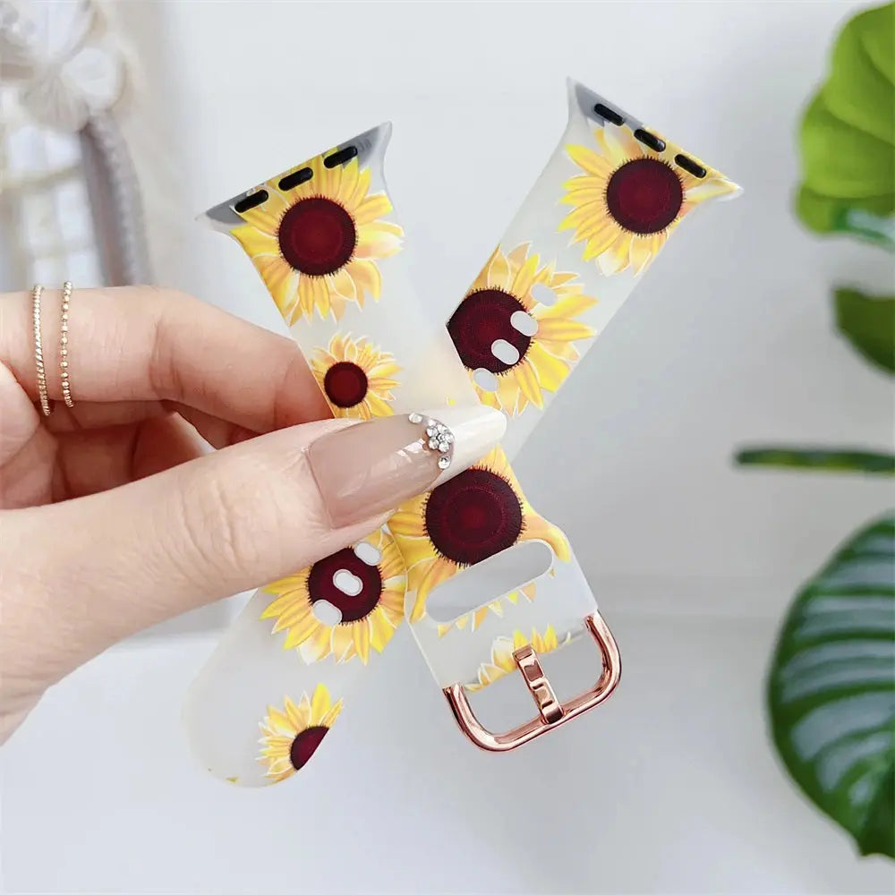 Clear silicone Apple Watch band with sunflower design, featuring a metal buckle and skin-friendly material.
