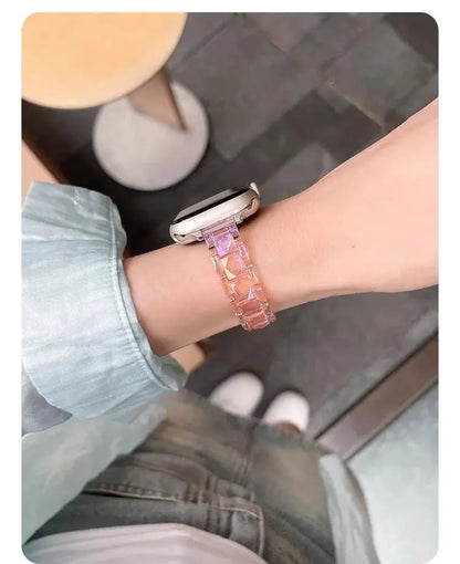 Woman wearing a Clear Slim Apple Watch Bracelet made of acrylic, showcasing a stylish and modern look.