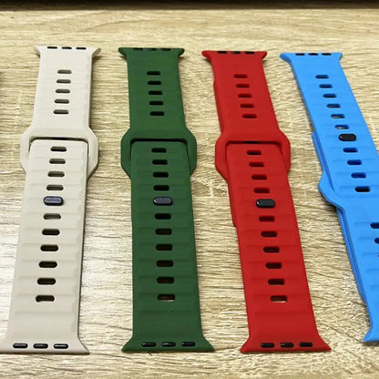 Rugged silicon sports bands in beige, green, red, and blue for Apple Watch, ideal for adventurers and sports enthusiasts.