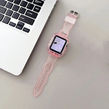 Crystal clear glittery silicone Apple Watch strap and case on a desk next to a laptop, showcasing elegant design.
