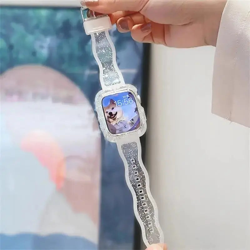 Transparent glittery silicone Apple Watch strap and case showcasing a sparkling design and displaying a watch face.