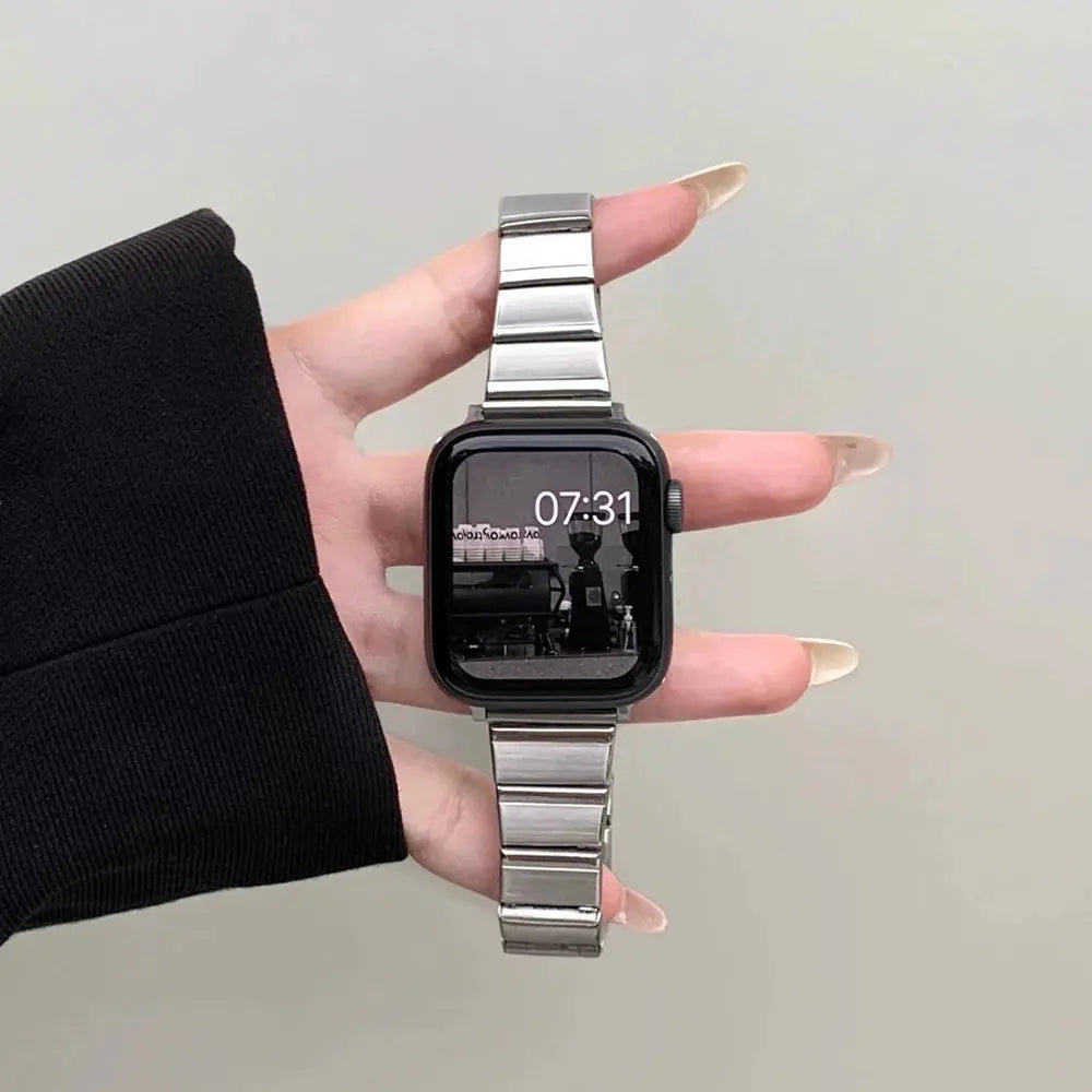 Close-up of a women's stainless steel bracelet on an Apple Watch, showcasing elegance and versatility for any outfit.
