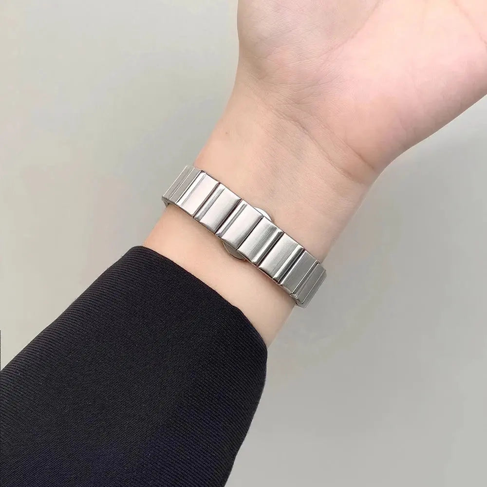 Stylish stainless steel bracelet on wrist, elevating Apple Watch with elegant polish. Perfect fit for any occasion.
