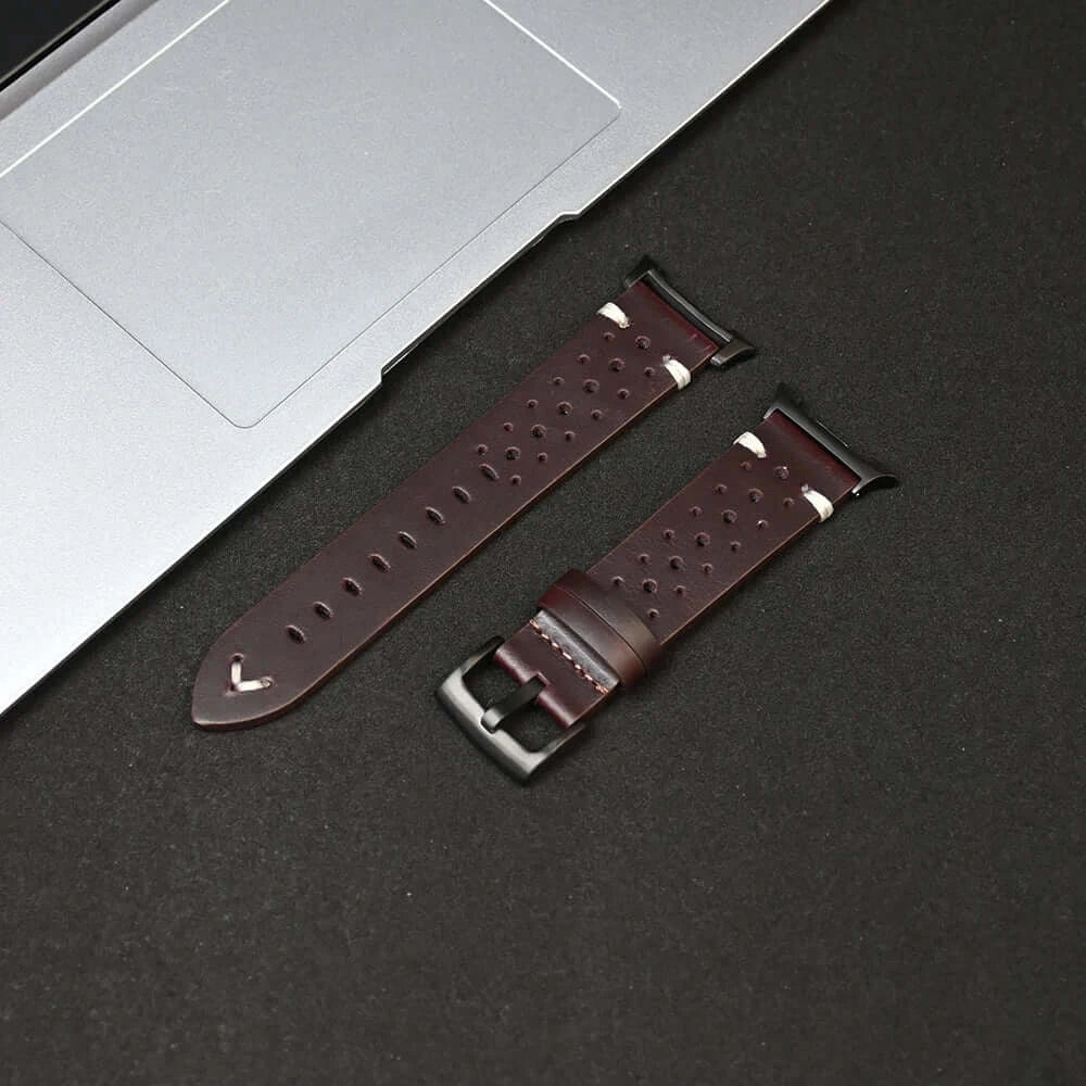 Leather Samsung Galaxy Watch 8 Bands | Classic & Ultra 47mm Strap displayed beside a laptop on a black surface.