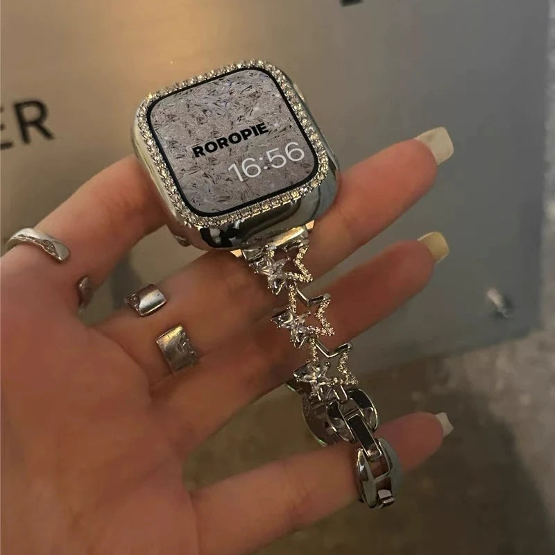 Luxury Diamond Apple Watch Band for Women – Star Metal Bracelet worn on a hand with a stylish silver design and rhinestones.