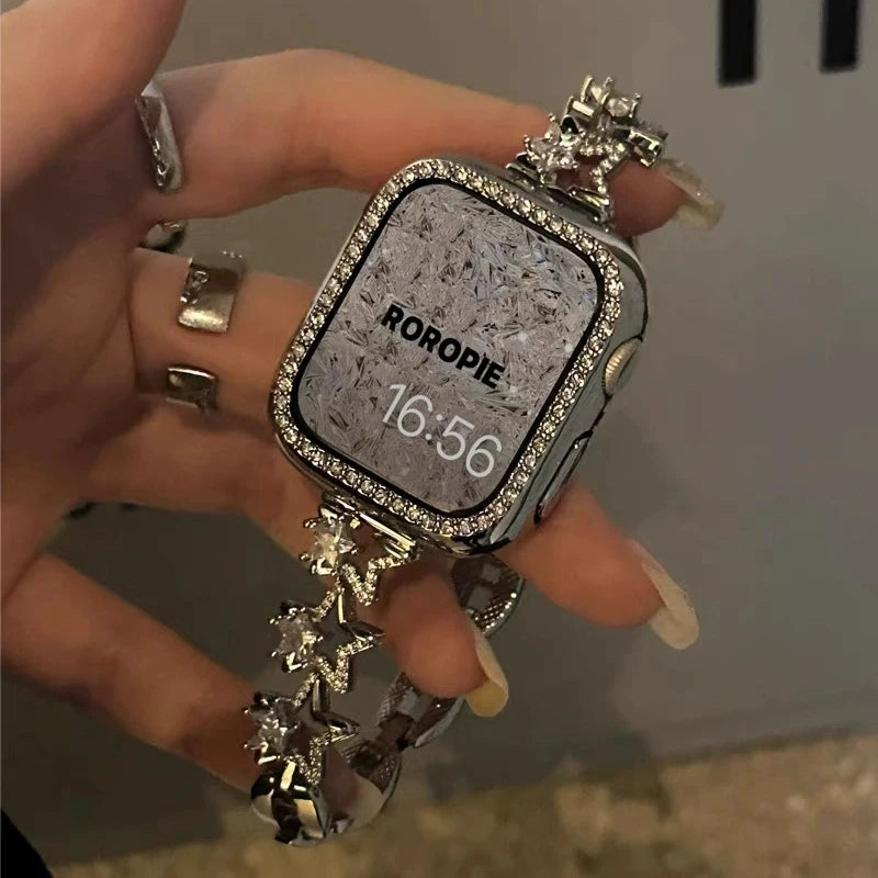 Luxury Diamond Apple Watch Band for Women – Star Metal Bracelet worn on hand with decorative rhinestones.