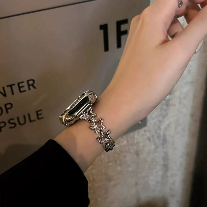 Luxury Diamond Apple Watch Band for Women – Star Metal Bracelet worn on a hand with a stylish design and rhinestones.
