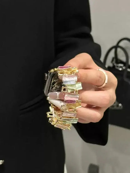 Luxury Elastic Metal Bracelet Band for Apple Watch Women showcased on wrist with colorful gemstone accents.