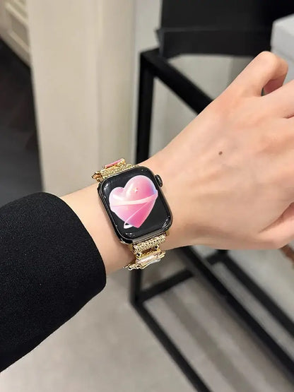Luxury Elastic Metal Bracelet Band for Apple Watch Women worn on a wrist with pink heart watch face.