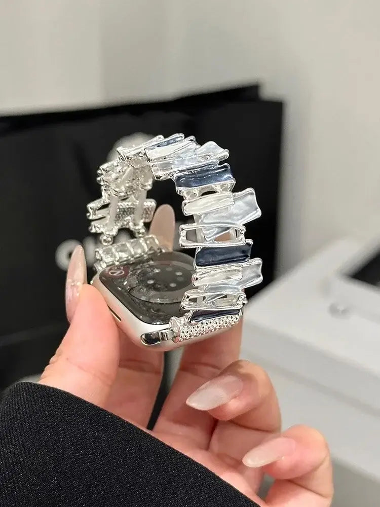 Luxury Elastic Metal Bracelet Band for Apple Watch Women showcased on a hand with colorful accents.
