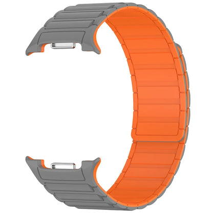 Magnetic Silicone Loop Band for Samsung Galaxy Watch 8 40/44/46mm in gray and orange design.