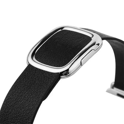 Close-up of a modern buckle band made of black leather, featuring a stylish silver magnetic closure for Apple Watch.