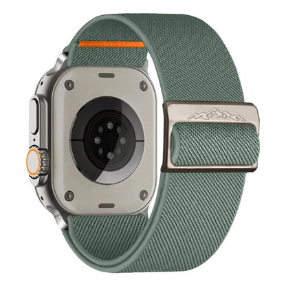 Nylon elastic strap with titanium buckle for Apple Watch, featuring a braided solo loop design in green and orange accents.