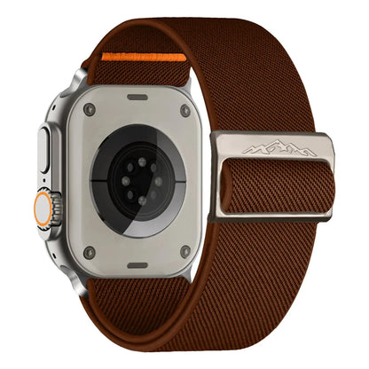 Nylon elastic strap with titanium buckle on an Apple Watch, showcasing a braided solo loop in brown.