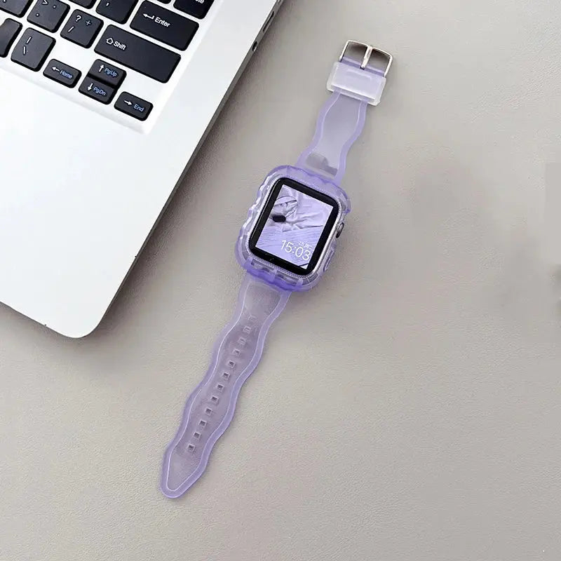 Crystal Clear Glittery Silicone Apple Watch Strap in purple beside a laptop, showcasing a stylish and modern look.