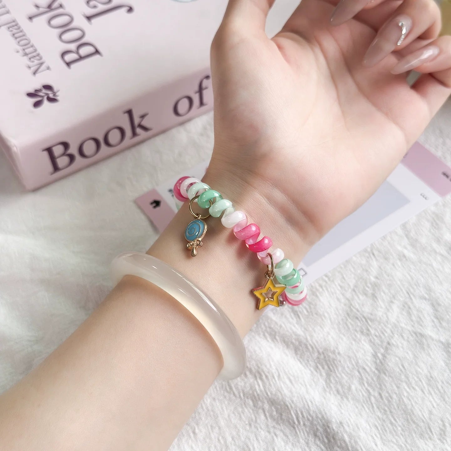 Rainbow Scrunchie Bracelet Apple Watch Band 38–49mm – Elastic Charm Strap with colorful beads and charms on wrist.