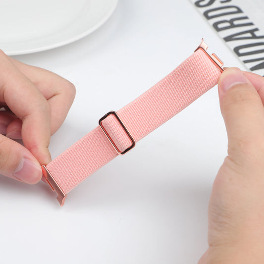Scrunchie Elastic Nylon Band for Galaxy Watch 8 & Classic 46mm in pink being held, showcasing its stylish design and comfort.