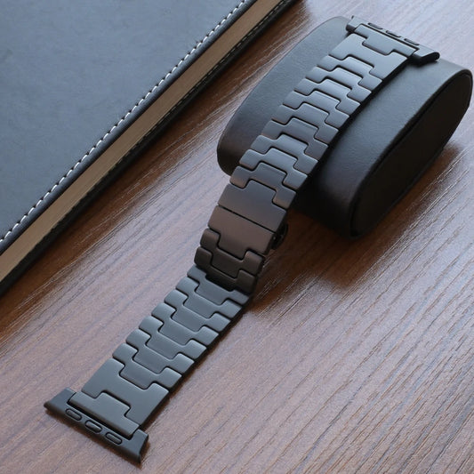 Titanium Apple Watch Band Ultra 3/Series 11/SE – Luxury Bracelet displayed on a black padded holder.