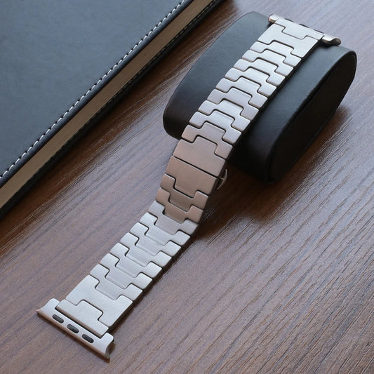 Titanium Apple Watch Band Ultra 3/Series 11/SE – Luxury Bracelet on a leather surface.