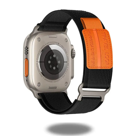 Travel Loop for Apple Watch with stylish black band and sporty orange fastener for enhanced fit.