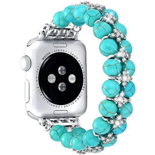 Pearl Beaded Apple Watch Band with turquoise beads and rhinestone accents on a silver watch face.