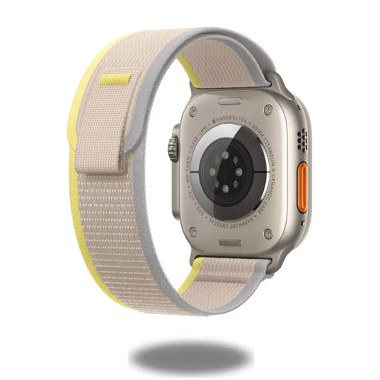 Back view of Apple Watch with lightweight Trail Loop Band, featuring soft nylon weave and quick-adjust pull tab.