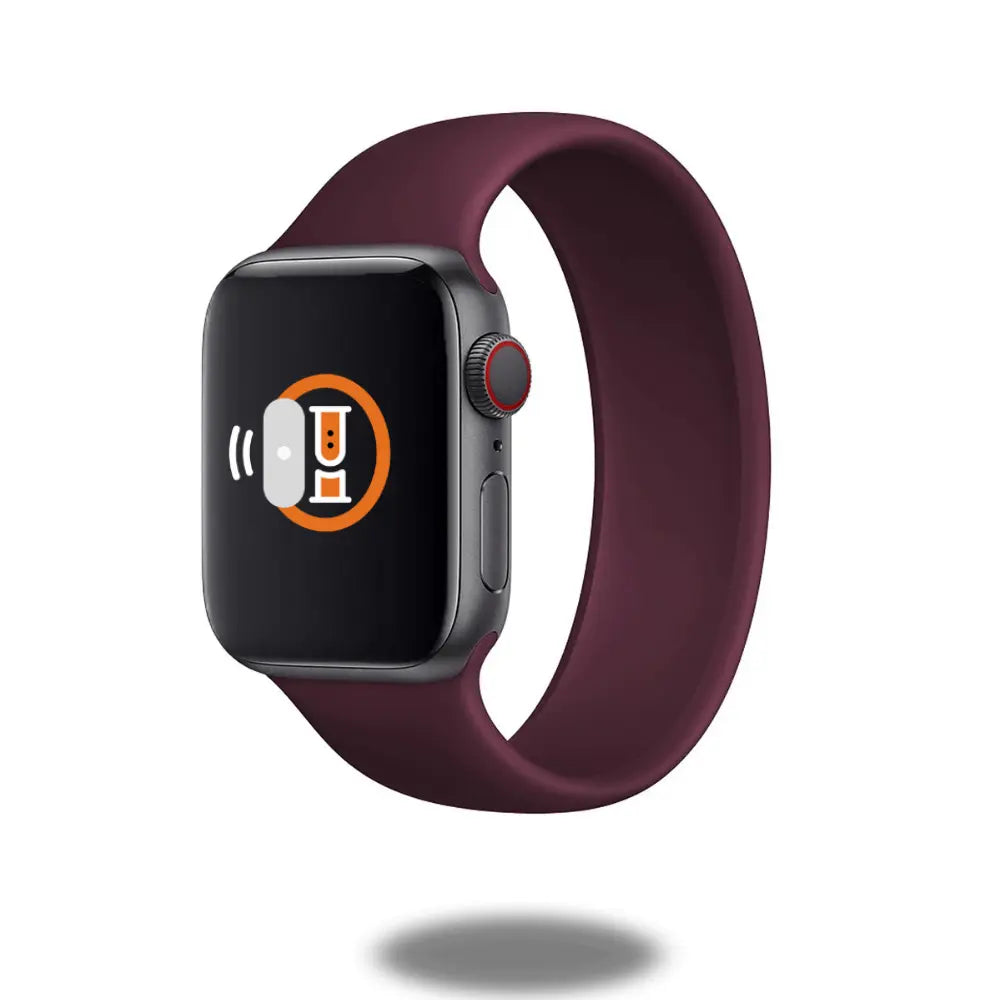 Silicone Solo Loop Band in burgundy with no clasps, designed for comfort and style, showcasing a smartwatch.