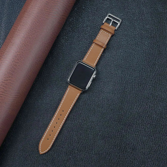 Classic Single Tour Leather Straps (Brown) featured with a stylish Apple Watch on a textured background.