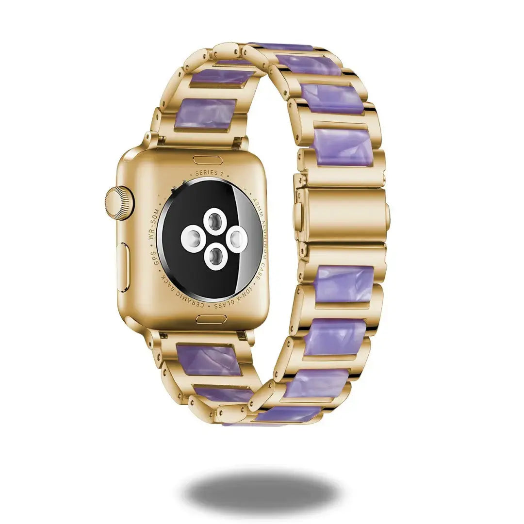 Luxury gold watch with purple resin strap, stylish design, elegant craftsmanship, and premium stainless steel frame.